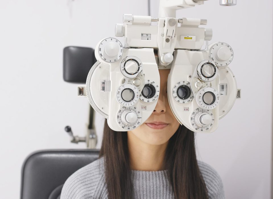 Asian Woman doing eye test in clinic